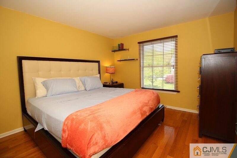 44 Cannon Road Old Bridge, NJ 08857 - Photo 16 of 24 a bed sitting in a bedroom next to a window