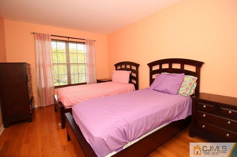 44 Cannon Road Old Bridge, NJ 08857 - Photo 17 of 24 a bedroom with a bed and wooden floor