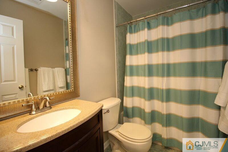44 Cannon Road Old Bridge, NJ 08857 - Photo 18 of 24 a bathroom with a sink a toilet a shower curtain