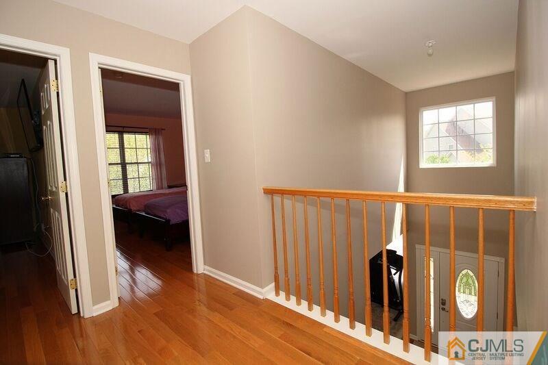 44 Cannon Road Old Bridge, NJ 08857 - Photo 20 of 24 a view of a hallway with wooden floor and a bedroom