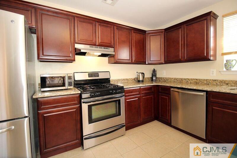 44 Cannon Road Old Bridge, NJ 08857 - Photo 4 of 24 a kitchen with stainless steel appliances granite countertop a stove a sink and a refrigerator