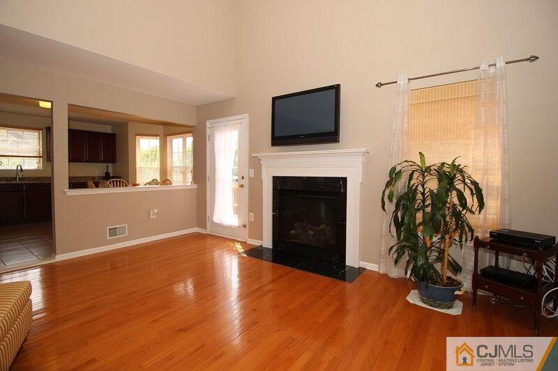44 Cannon Road Old Bridge, NJ 08857 - Photo 10 of 24 a view of a livingroom with wooden floor and a fireplace
