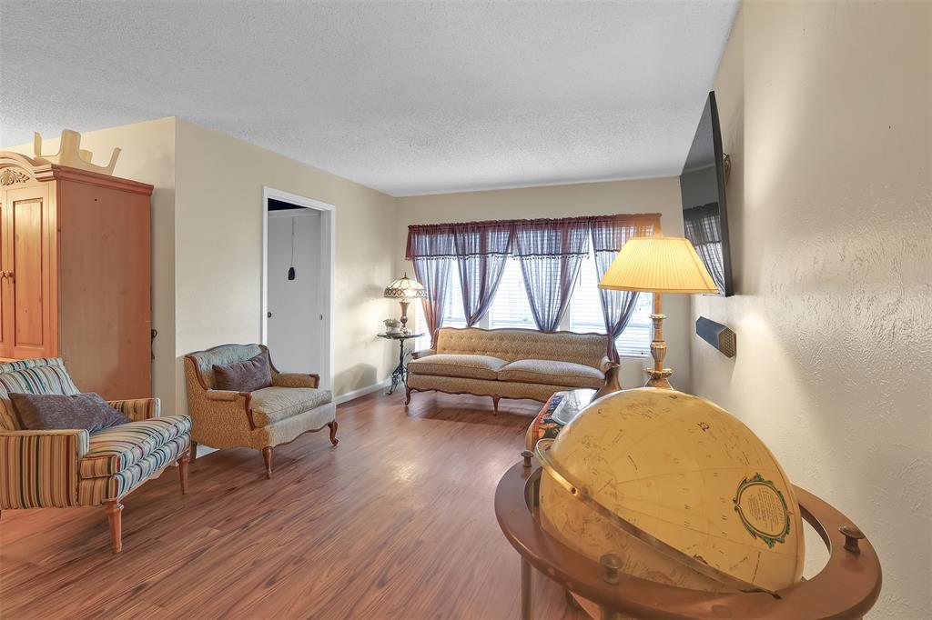 5624 Boca Raton Boulevard, Unit 133 Fort Worth, TX 76112 - Photo 2 of 19 a living room with furniture and a fireplace