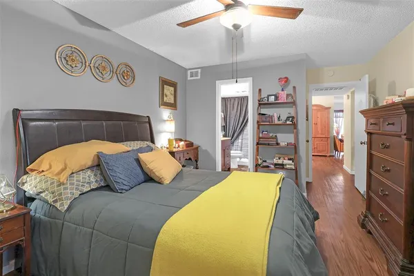 a bedroom with a bed and dresser