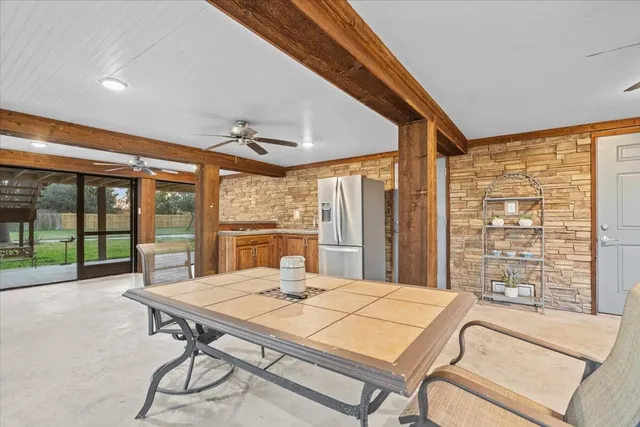 a bedroom with a large bed and a large window