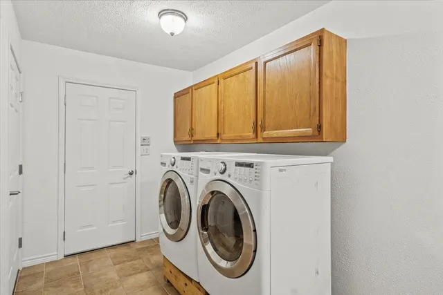 a view of a porch with furniture and garden
