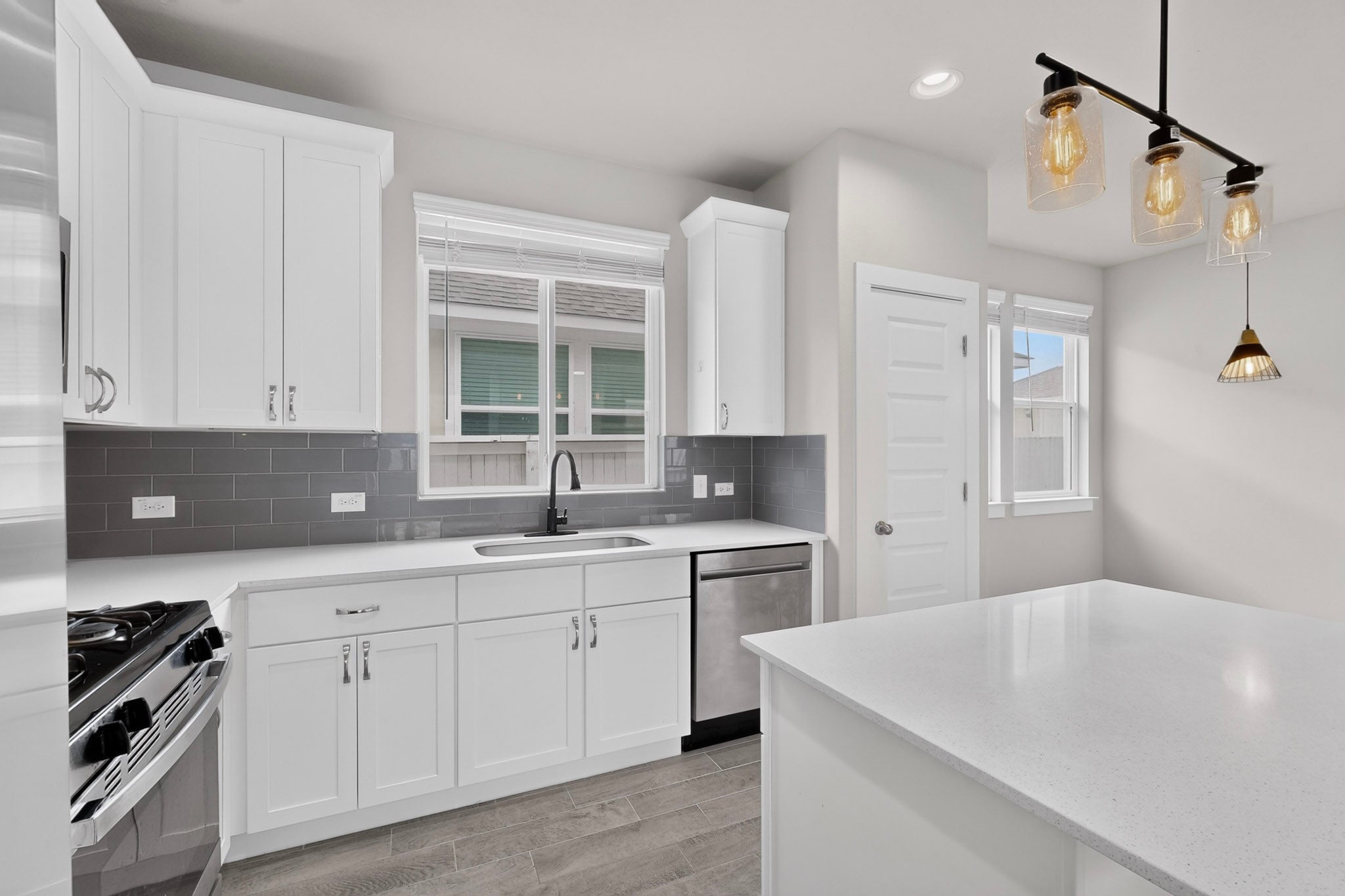 116 Appleberry Lane Elgin, TX 78621 - Photo 10 of 35 A well-lit kitchen with sleek countertops and modern fixtures awaits culinary adventures.