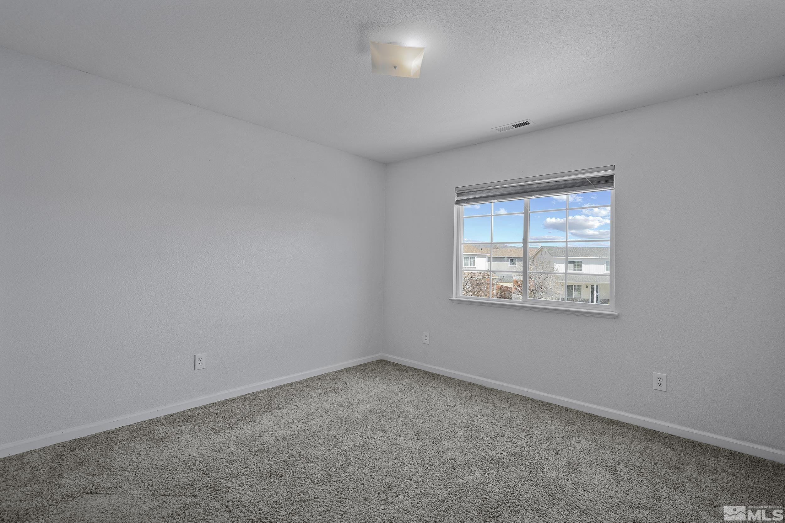 17940 Drift Creek Court Reno, NV 89508 - Photo 16 of 26 an empty room with windows