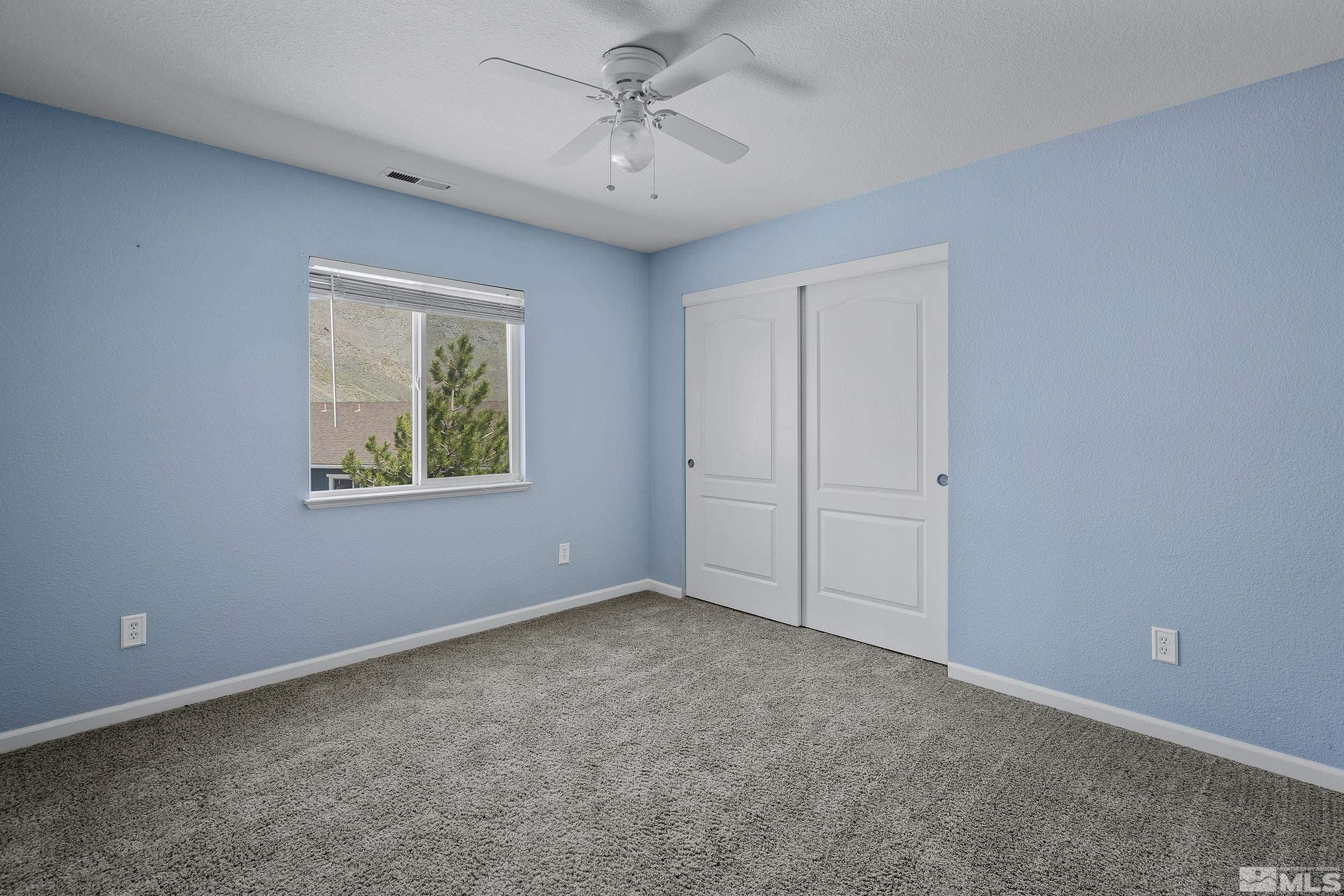 17940 Drift Creek Court Reno, NV 89508 - Photo 17 of 26 an empty room with windows and closet