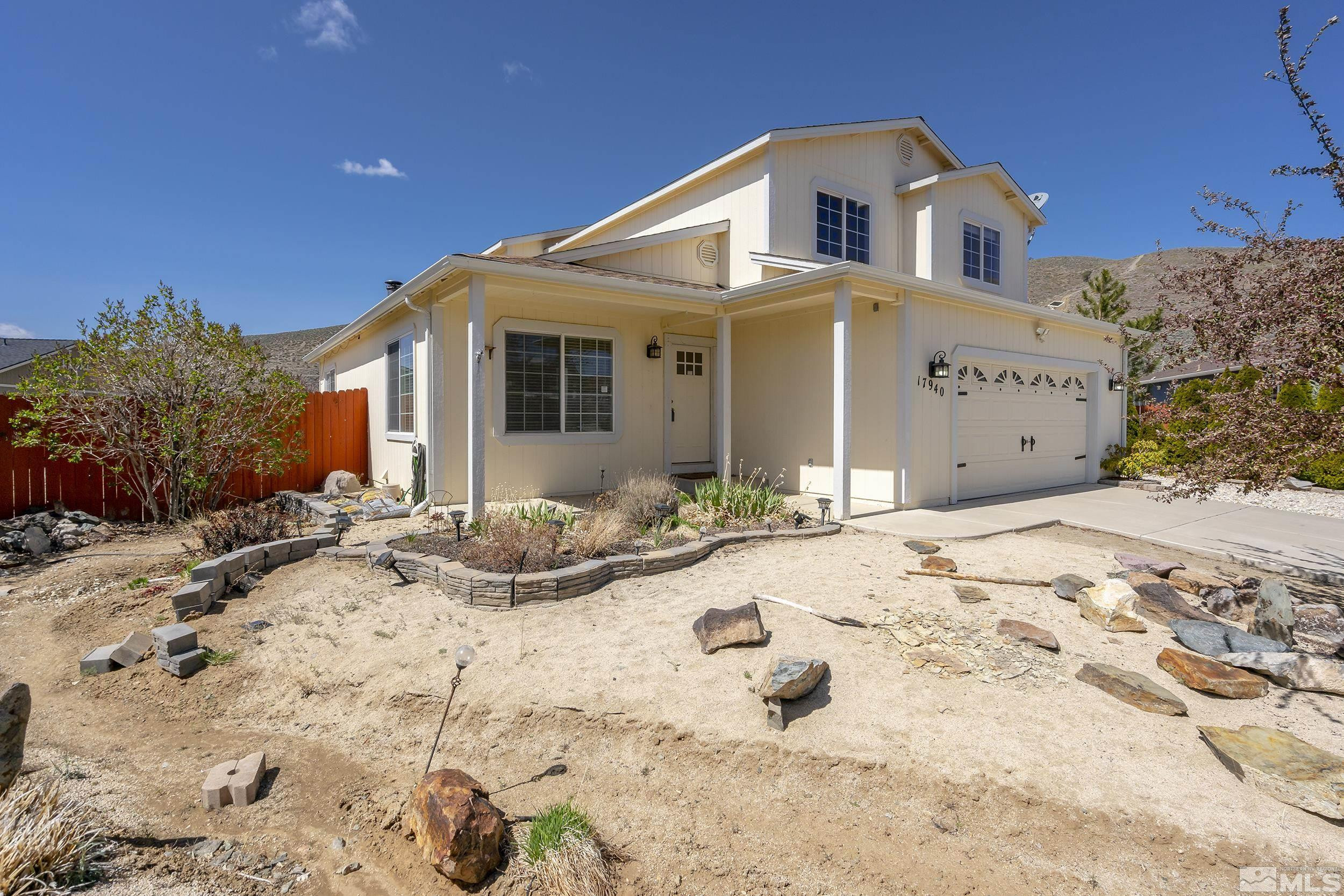 17940 Drift Creek Court Reno, NV 89508 - Photo 2 of 26 a front view of a house with a yard