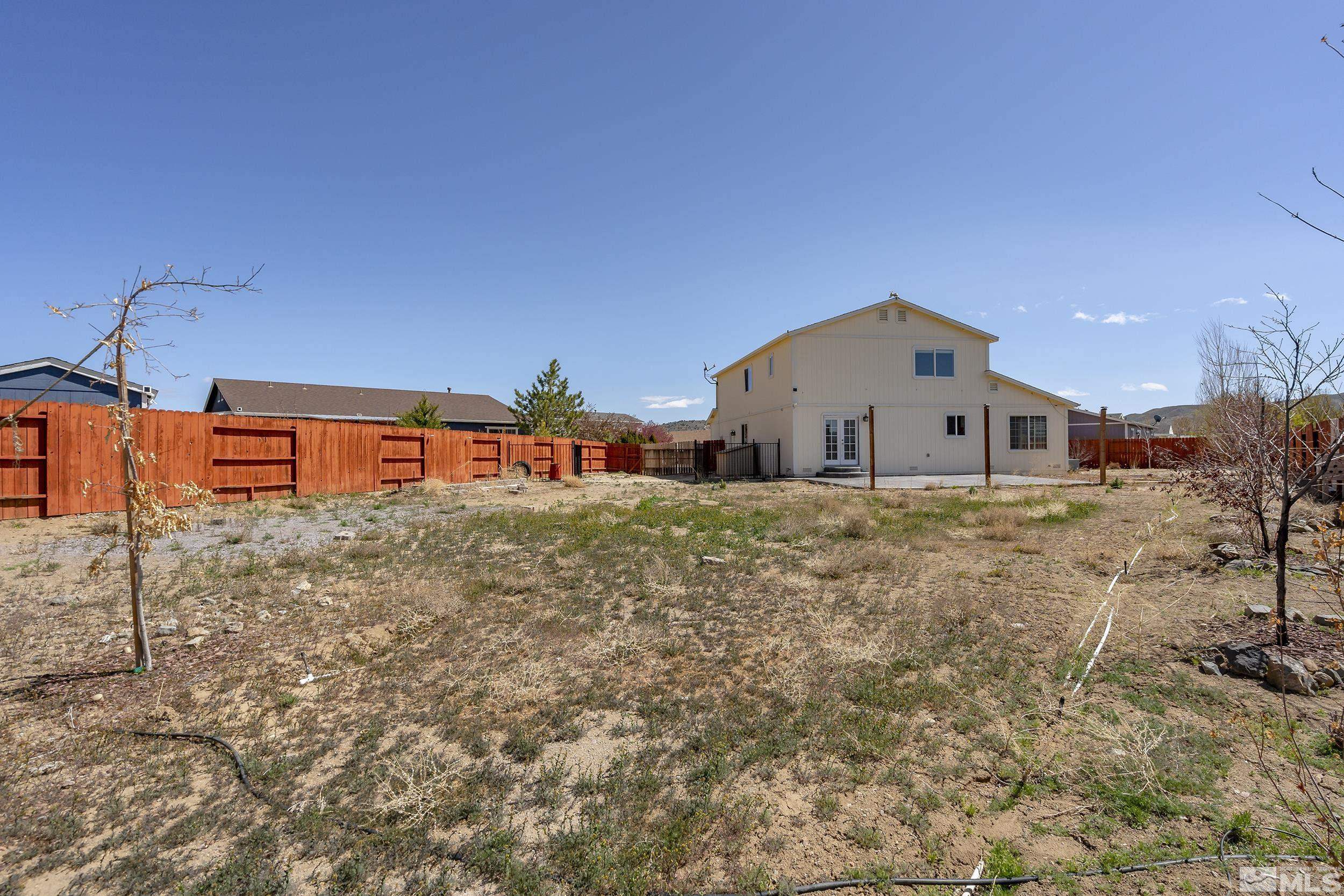 17940 Drift Creek Court Reno, NV 89508 - Photo 24 of 26 a house view with a yard