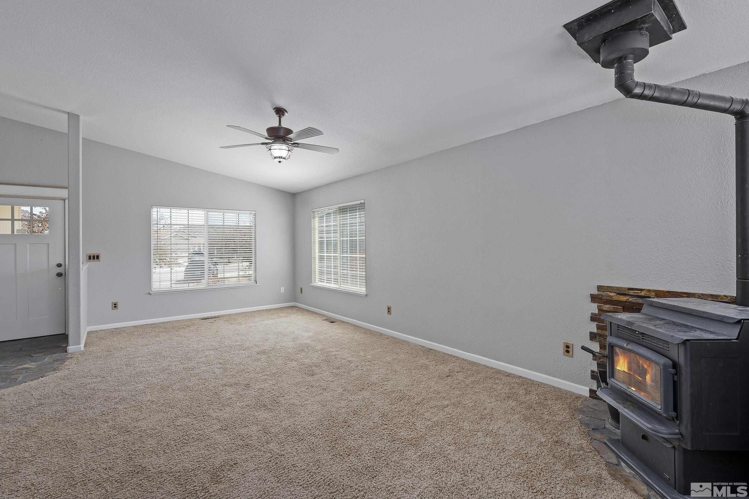 17940 Drift Creek Court Reno, NV 89508 - Photo 5 of 26 a view of an empty room with a window
