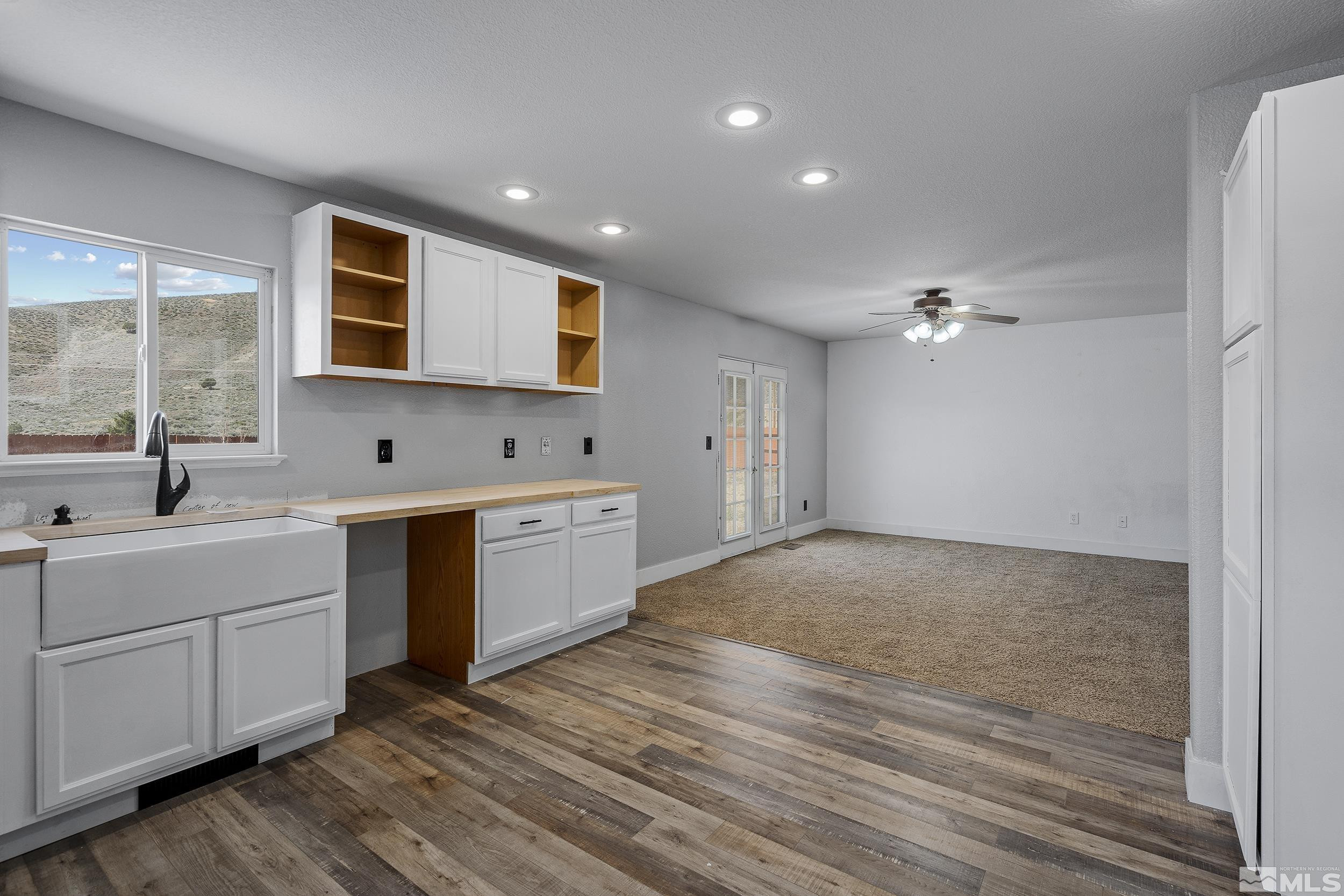 17940 Drift Creek Court Reno, NV 89508 - Photo 7 of 26 a view of a kitchen with sink cabinets and wooden floor
