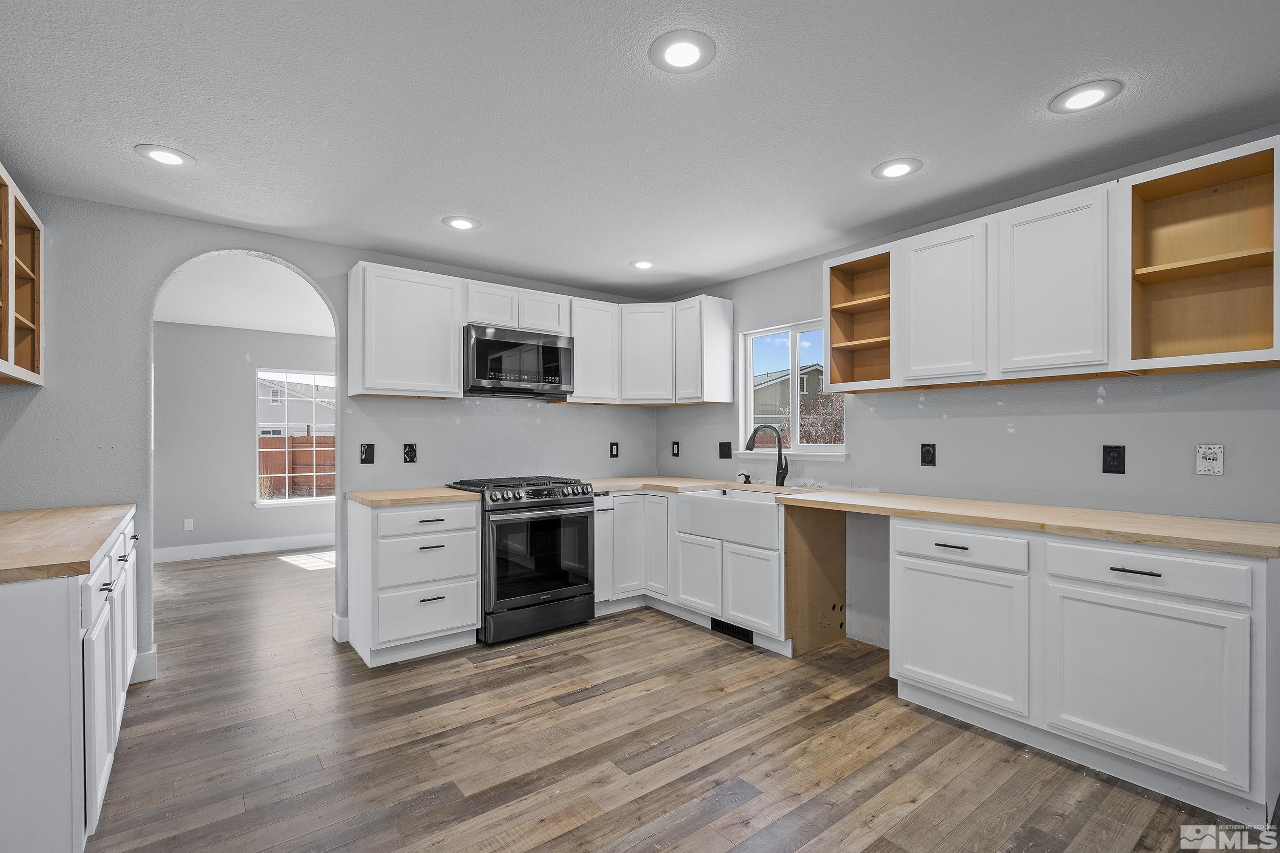 17940 Drift Creek Court Reno, NV 89508 - Photo 9 of 26 a kitchen with granite countertop a sink cabinets stainless steel appliances and a counter space