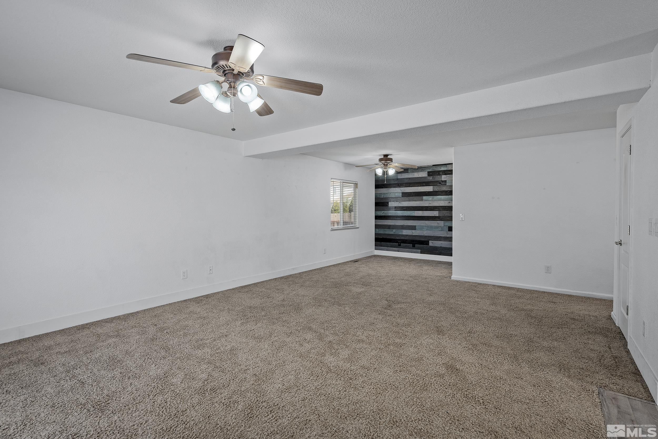 17940 Drift Creek Court Reno, NV 89508 - Photo 10 of 26 a view of an empty room and chandelier fan
