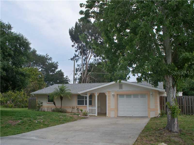 160 Shell Road Venice, FL 34293 - Photo 1 of 1 a front view of a house with a garden