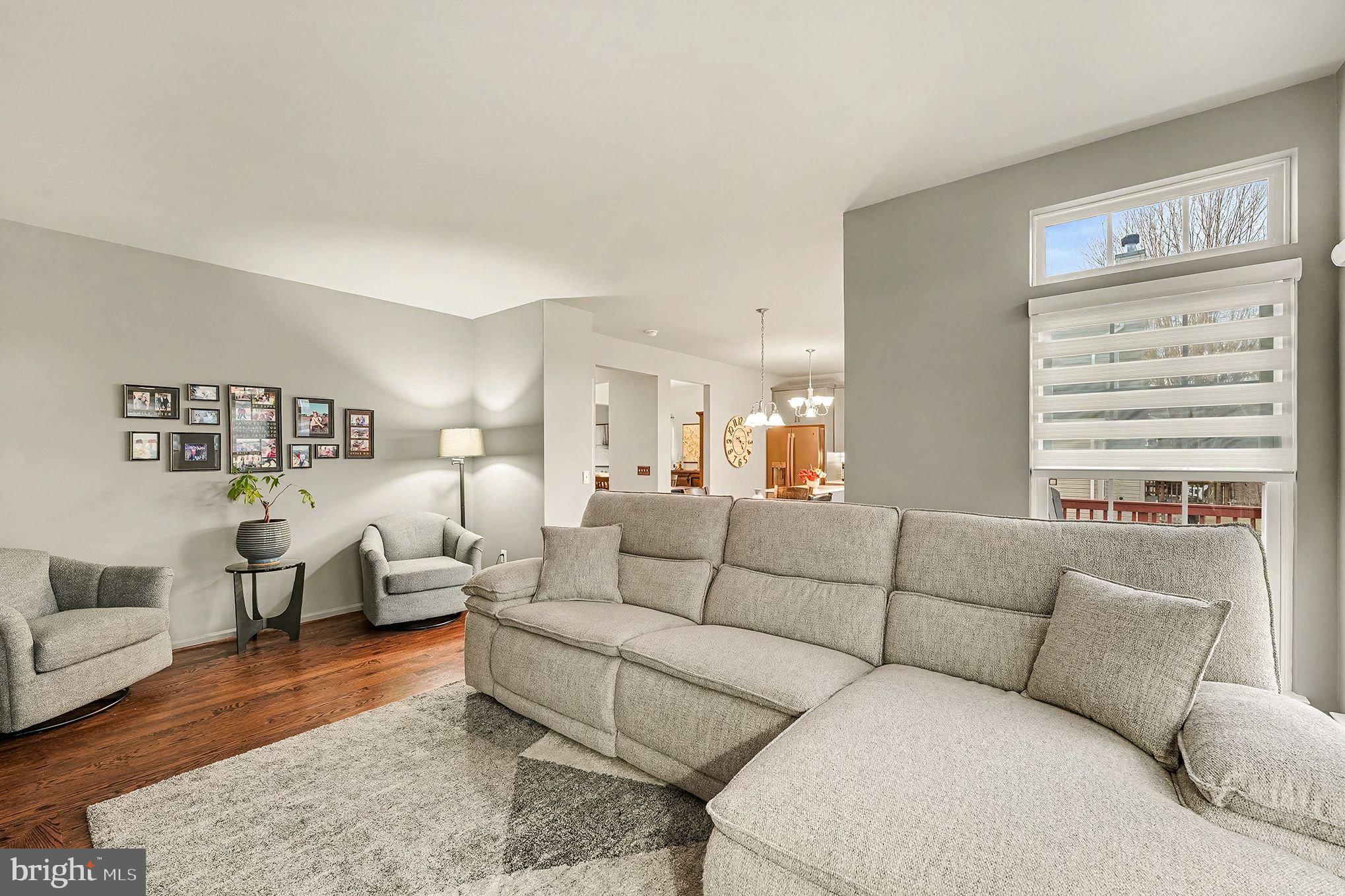 6465 Colonial Village Loop Manassas, VA 20112 - Photo 15 of 39 a living room with furniture and a large window