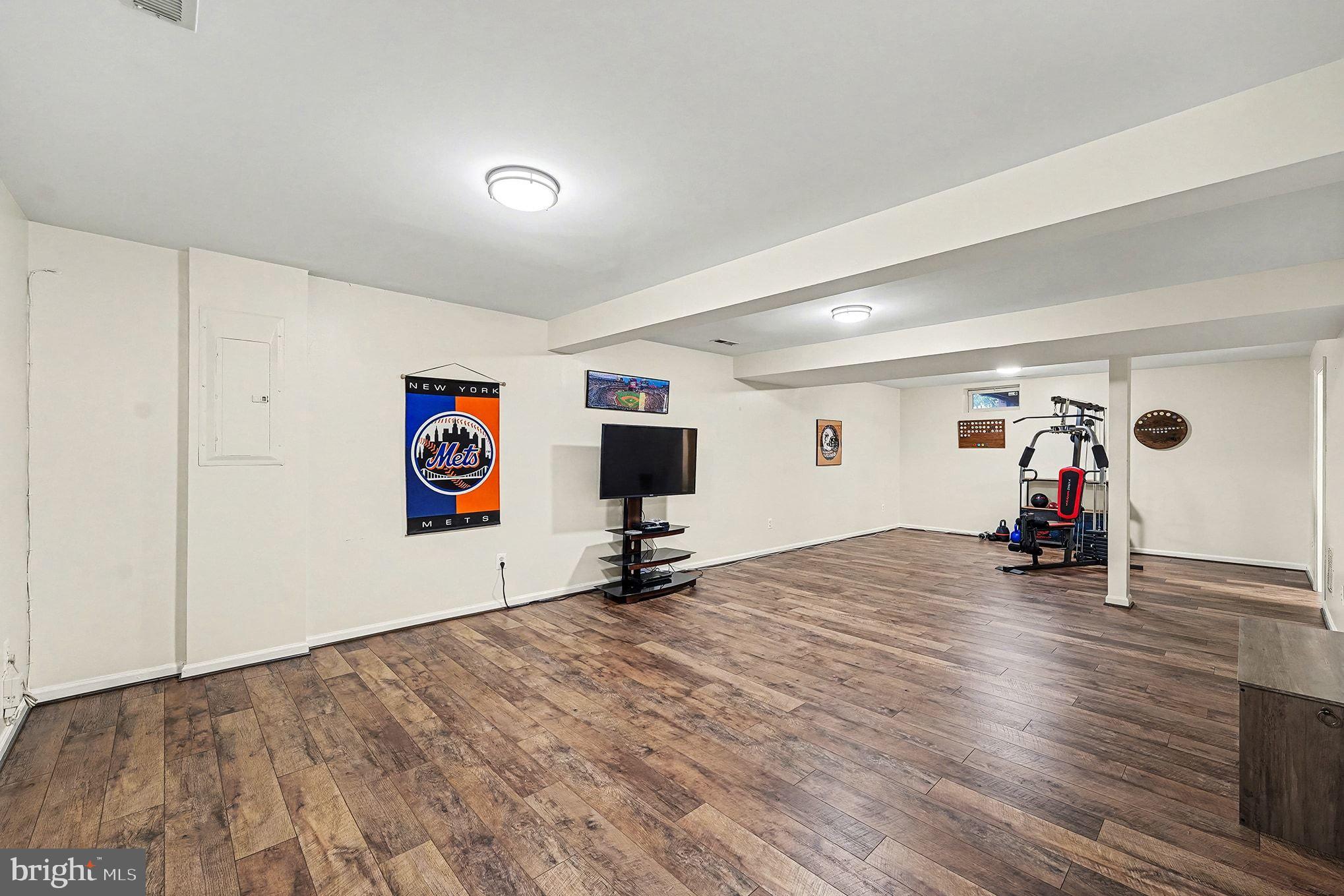 6465 Colonial Village Loop Manassas, VA 20112 - Photo 30 of 39 a view of a room with gym equipment and a large mirror
