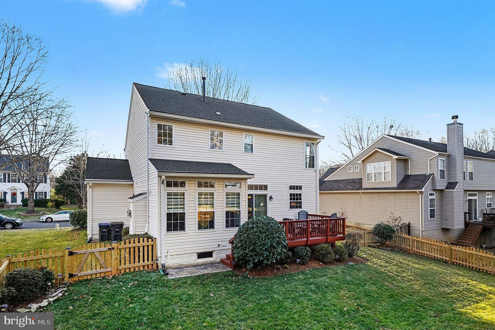 6465 Colonial Village Loop Manassas, VA 20112 - Photo 33 of 39 a front view of a house with a yard table and chairs