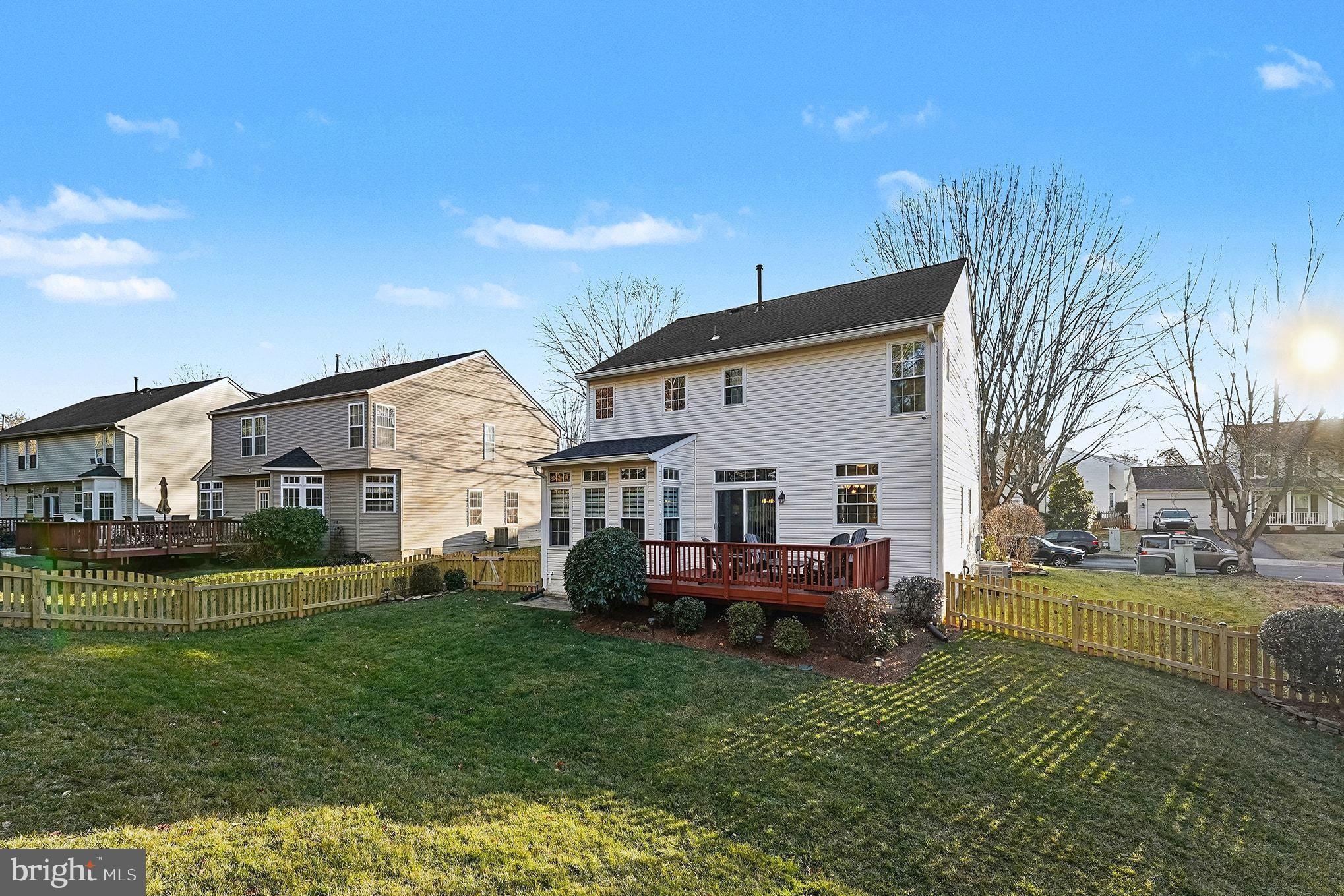 6465 Colonial Village Loop Manassas, VA 20112 - Photo 34 of 39 a view of a house with a back yard