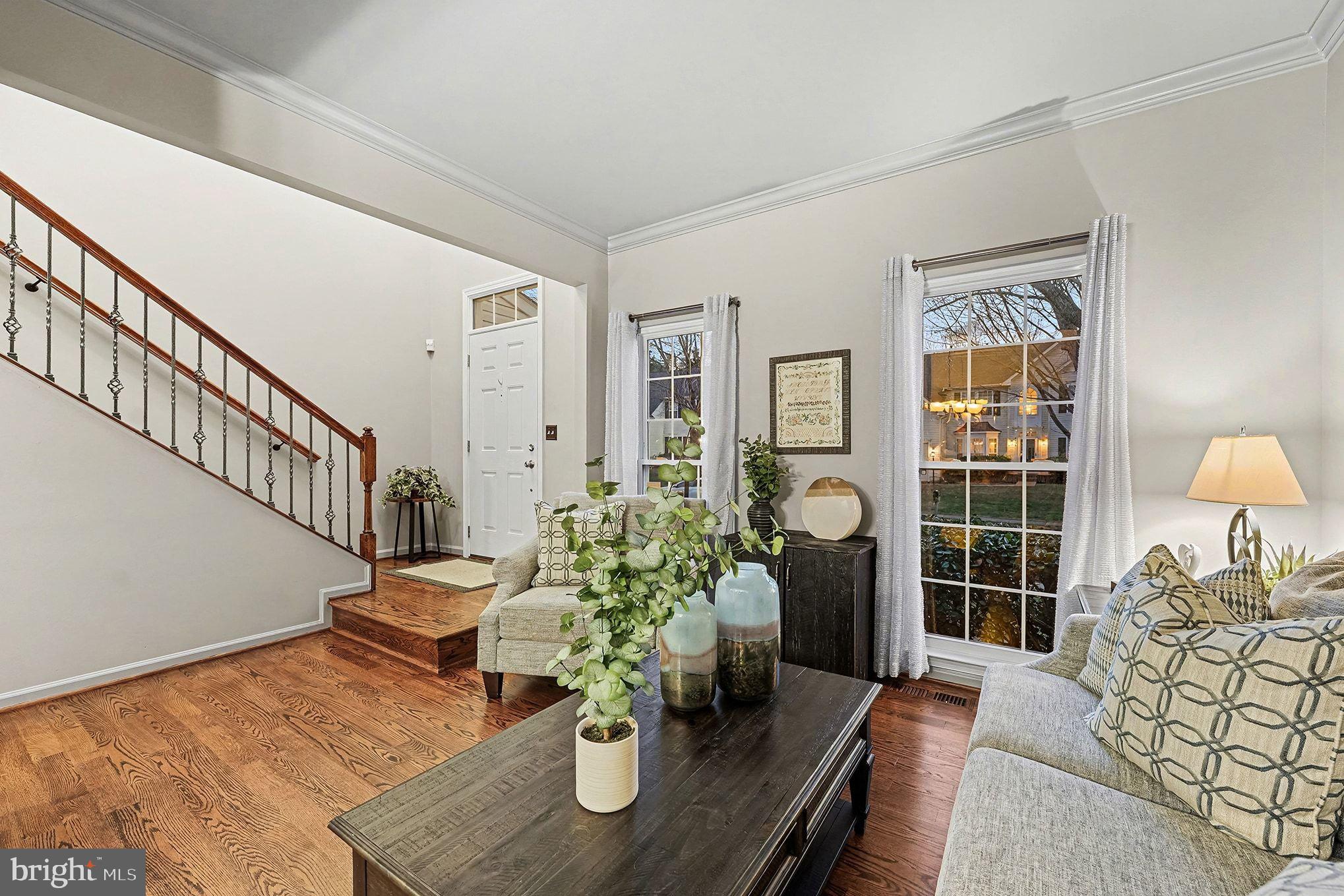 6465 Colonial Village Loop Manassas, VA 20112 - Photo 5 of 39 a living room with furniture flowerpot and wooden floor