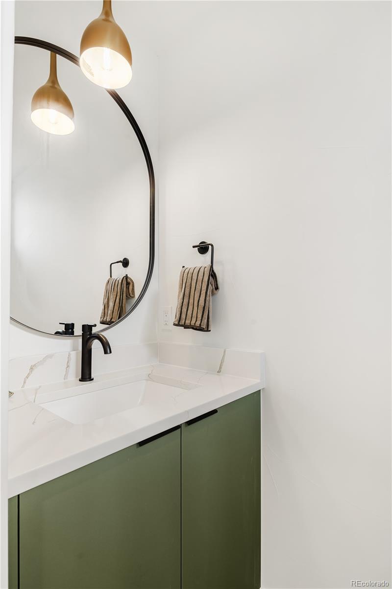 4511 Tennyson Street Denver, CO 80212 - Photo 11 of 34 a bathroom with a sink and mirror