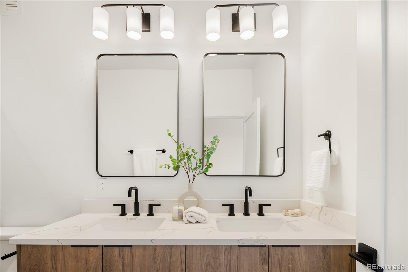 4511 Tennyson Street Denver, CO 80212 - Photo 18 of 34 a bathroom with a double vanity sink and a mirror