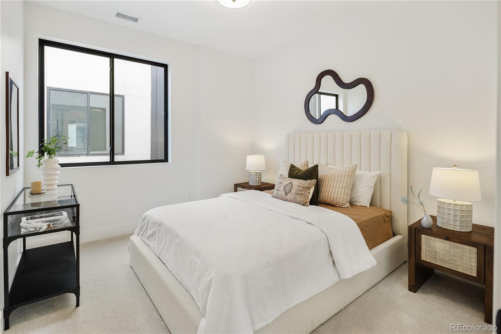 4511 Tennyson Street Denver, CO 80212 - Photo 21 of 34 a bedroom with a bed and a window