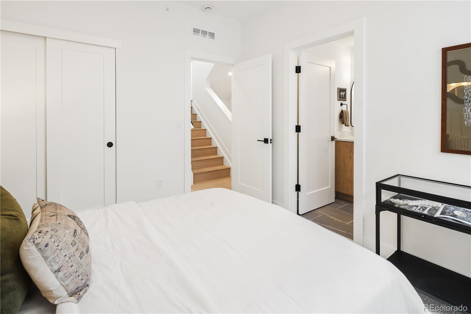 4511 Tennyson Street Denver, CO 80212 - Photo 23 of 34 a bedroom with a bed and a window