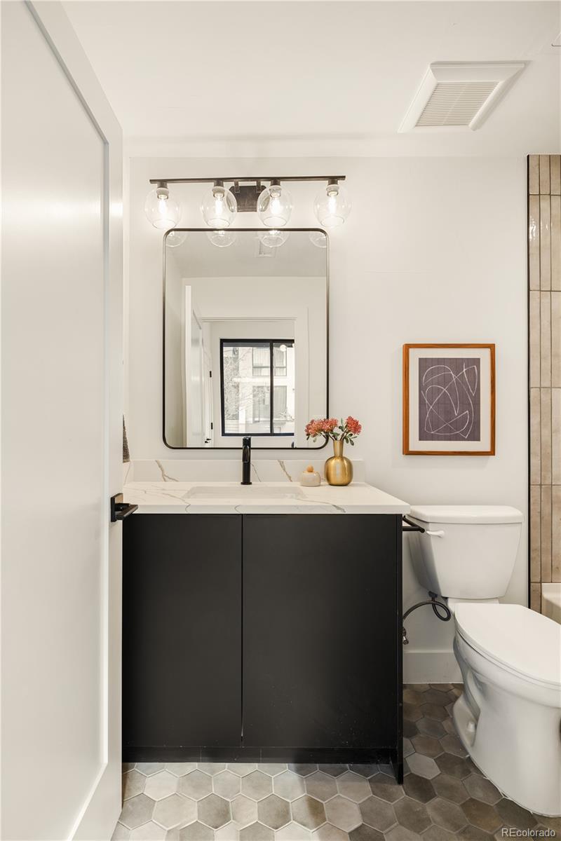 4511 Tennyson Street Denver, CO 80212 - Photo 27 of 34 a bathroom with a sink and a mirror