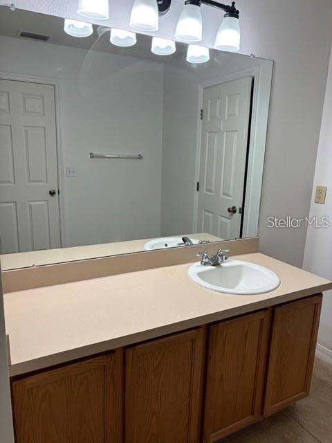 2417 Hibiscus Bay Lane Brandon, FL 33511 - Photo 21 of 36 a bathroom with a sink and mirror