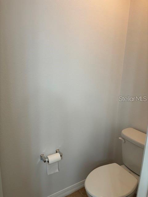 2417 Hibiscus Bay Lane Brandon, FL 33511 - Photo 22 of 36 a white toilet sitting next to a white wall