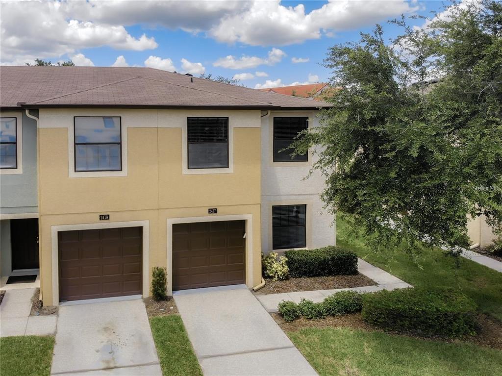 2417 Hibiscus Bay Lane Brandon, FL 33511 - Photo 34 of 36 a front view of a house with a garden