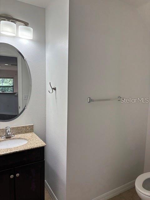 2417 Hibiscus Bay Lane Brandon, FL 33511 - Photo 9 of 36 a bathroom with a sink toilet and vanity