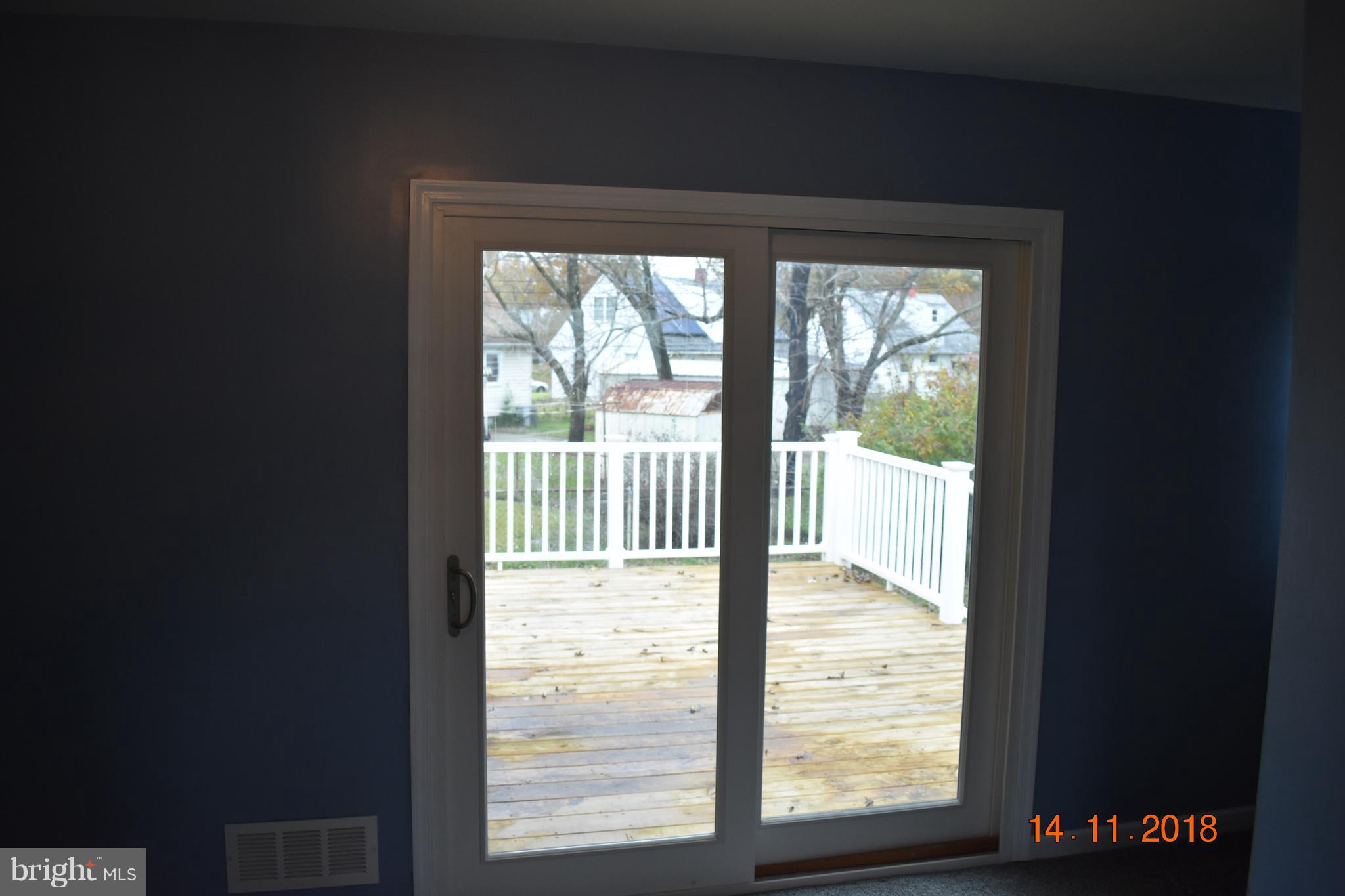1905 Ridgewick Road Glen Burnie, MD 21061 - Photo 7 of 25 Sliding patio door opens onto beautiful deck