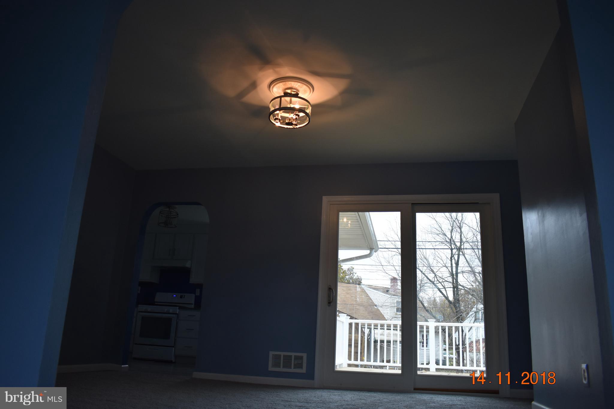 1905 Ridgewick Road Glen Burnie, MD 21061 - Photo 8 of 25 Dining room light with rousette & patio door