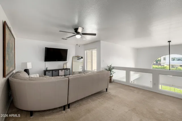 a bed room with a bed and a chandelier