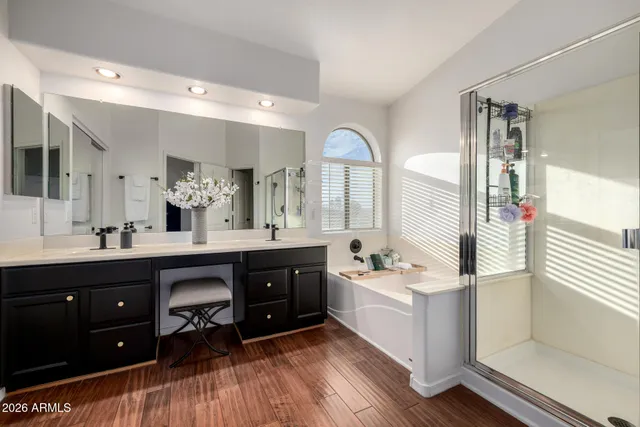 a bathroom with a bathtub and a sink