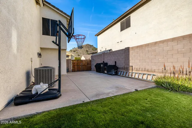 a view of a house with a backyard porch and sitting area