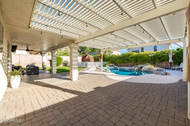 a view of swimming pool with a patio