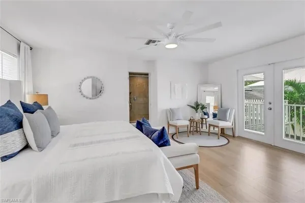 a bedroom with bed and a table