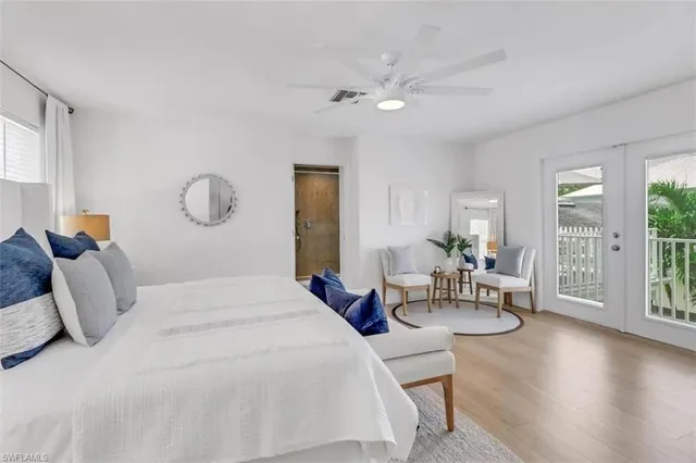 a bedroom with bed and a table