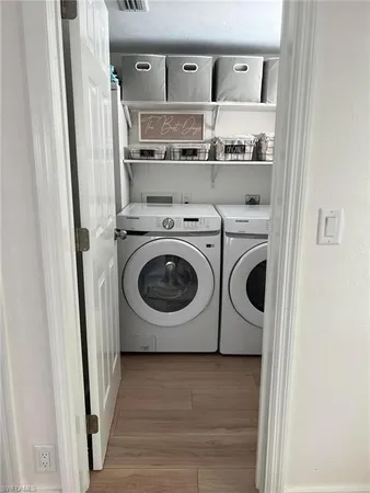 a utility room with dryer and washer