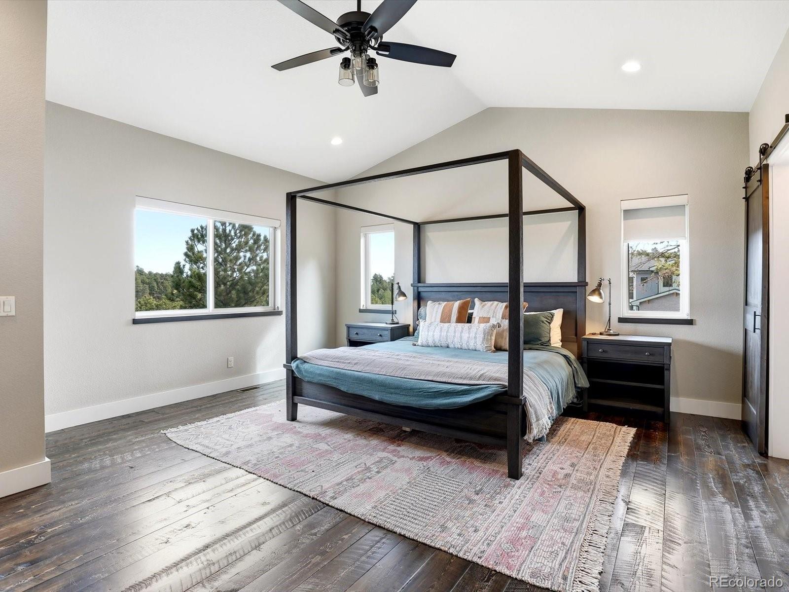 7333 Plowsher Way Morrison, CO 80465 - Photo 16 of 36 a bed room with a bed and a window