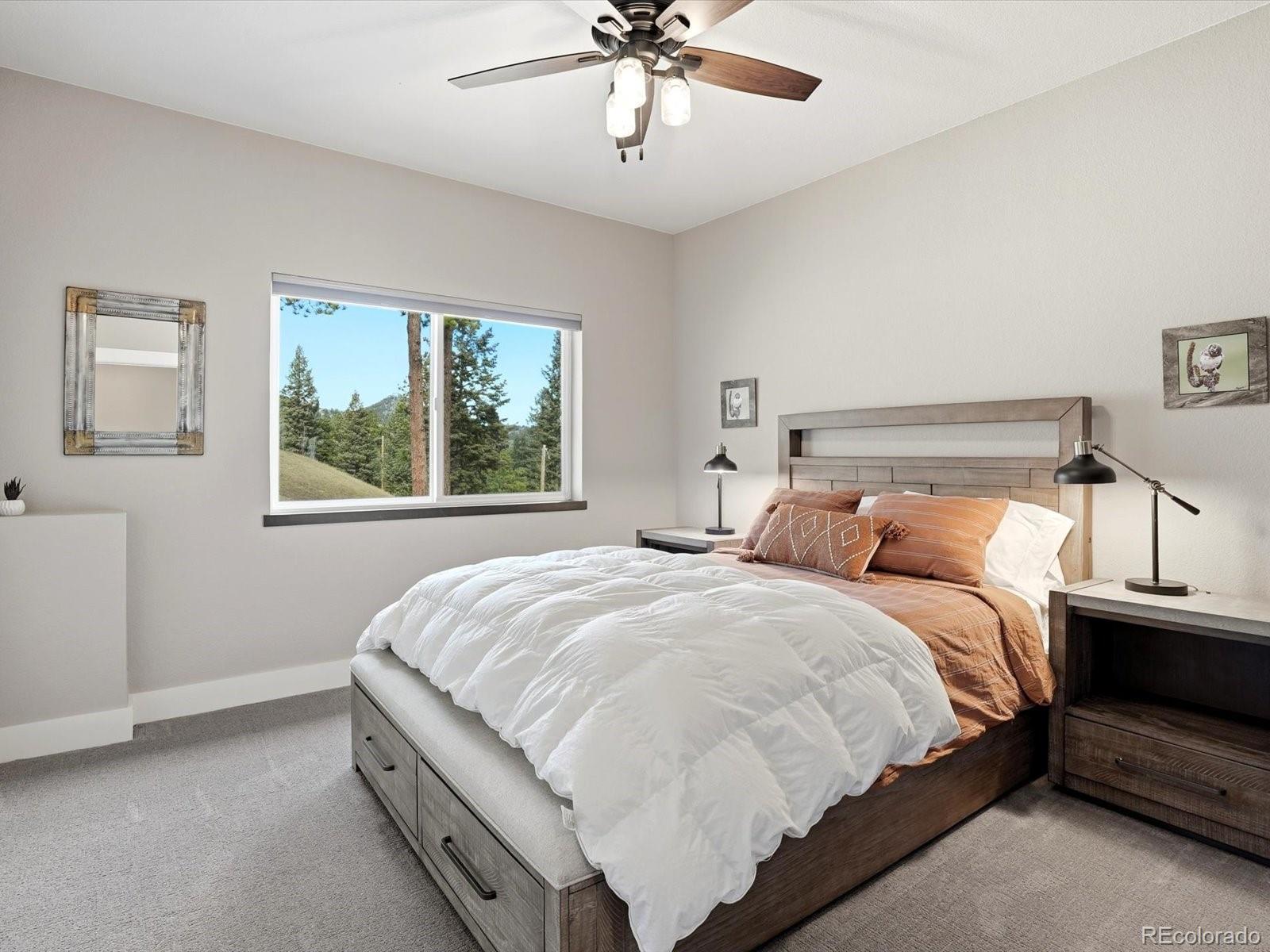 7333 Plowsher Way Morrison, CO 80465 - Photo 19 of 36 a bedroom with a bed and window