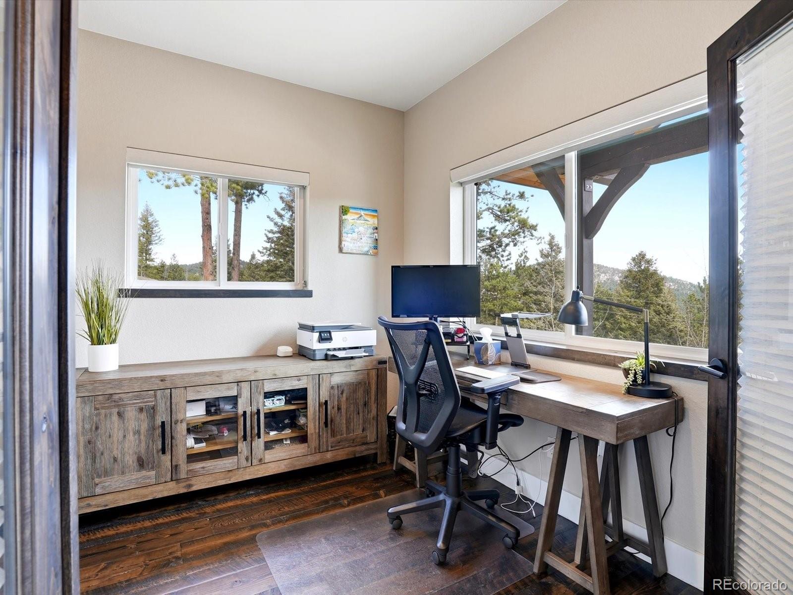 7333 Plowsher Way Morrison, CO 80465 - Photo 7 of 36 a view of a dining room with furniture window and outside view