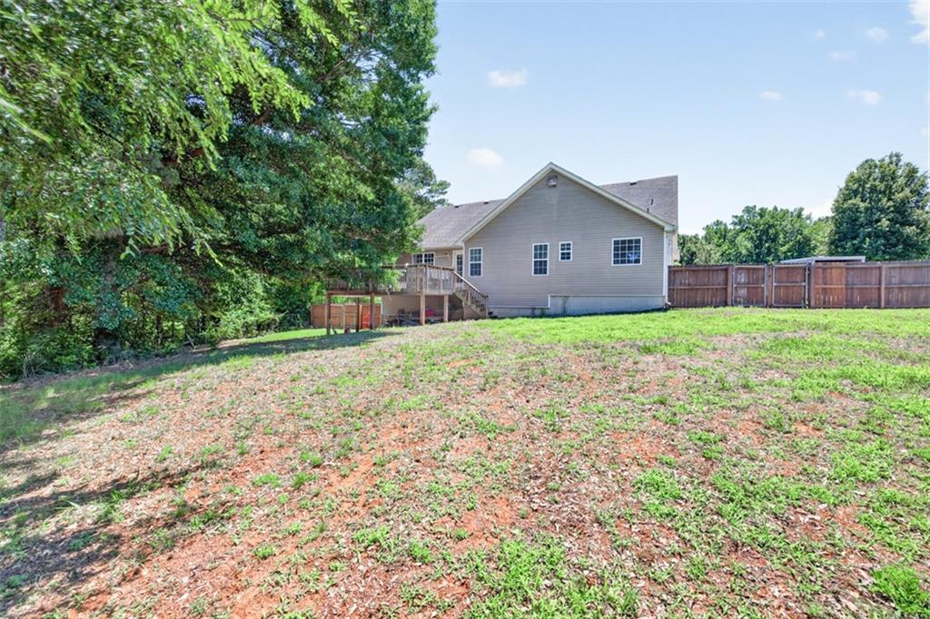 89 Katie Spring Lane Jefferson, GA 30549 - Photo 53 of 63 a house view with a outdoor space