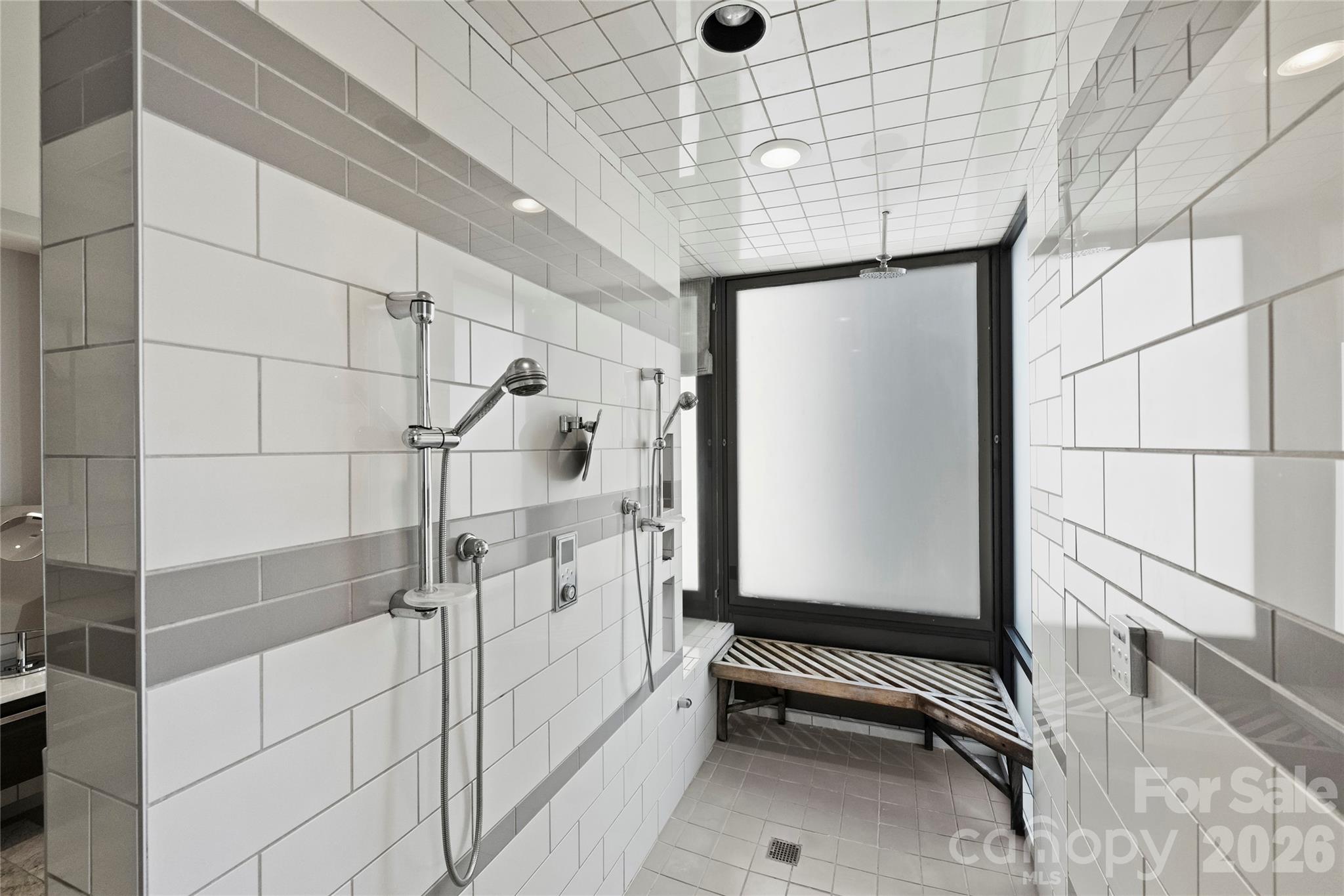 139 South Tryon Street, Unit 6 Charlotte, NC 28202 - Photo 35 of 47 a bathroom with a shower