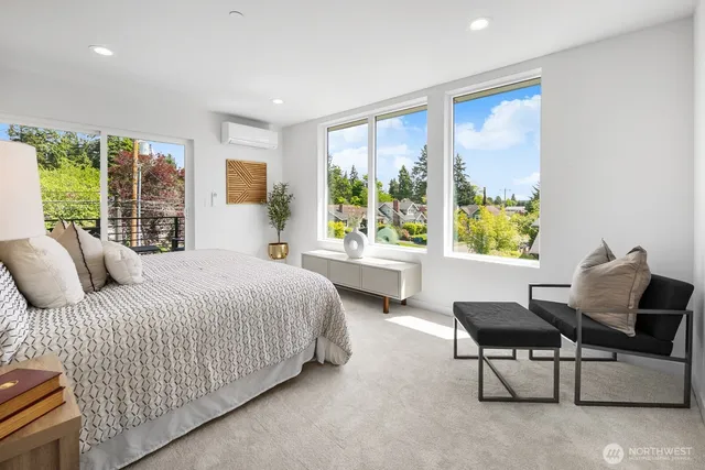 a bedroom with a bed and a balcony