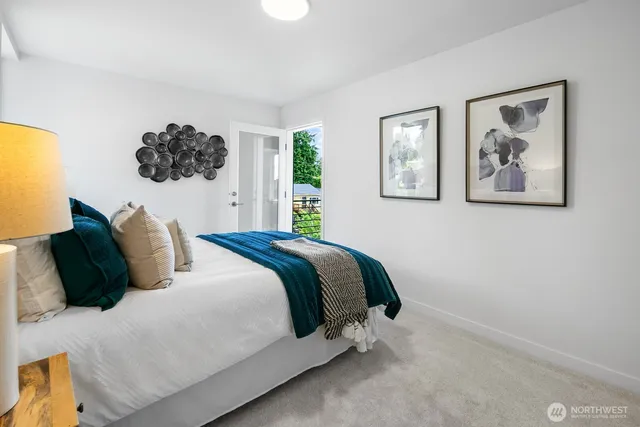 a bedroom with a bed and window